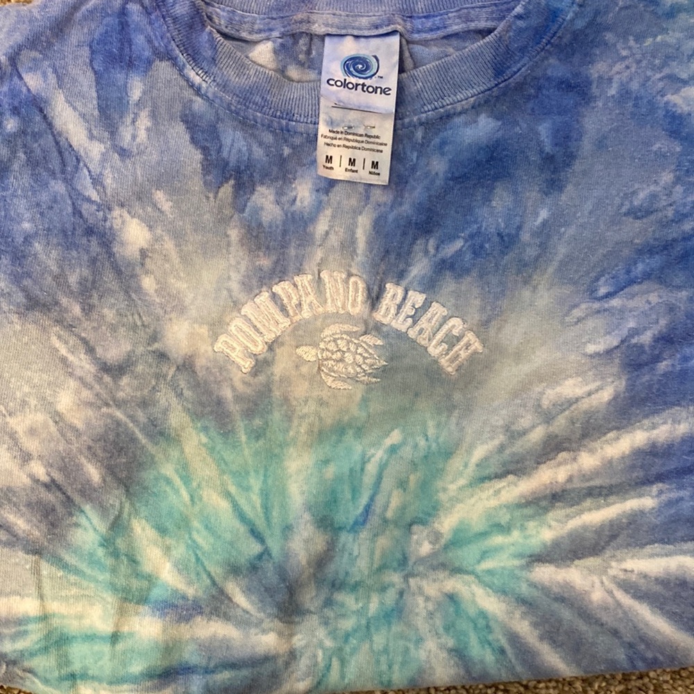 Size medium tie dyed shirt bought form a boutique never wore perfect condition